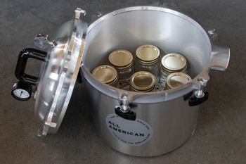 Inside view of All American 921 canner with pint jars loaded.